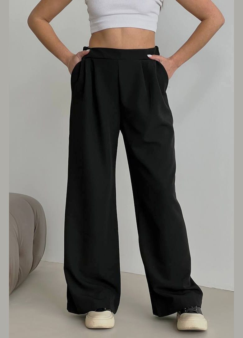 Штани жіночі розкльошені чорного кольору Let's Shop (294607502)