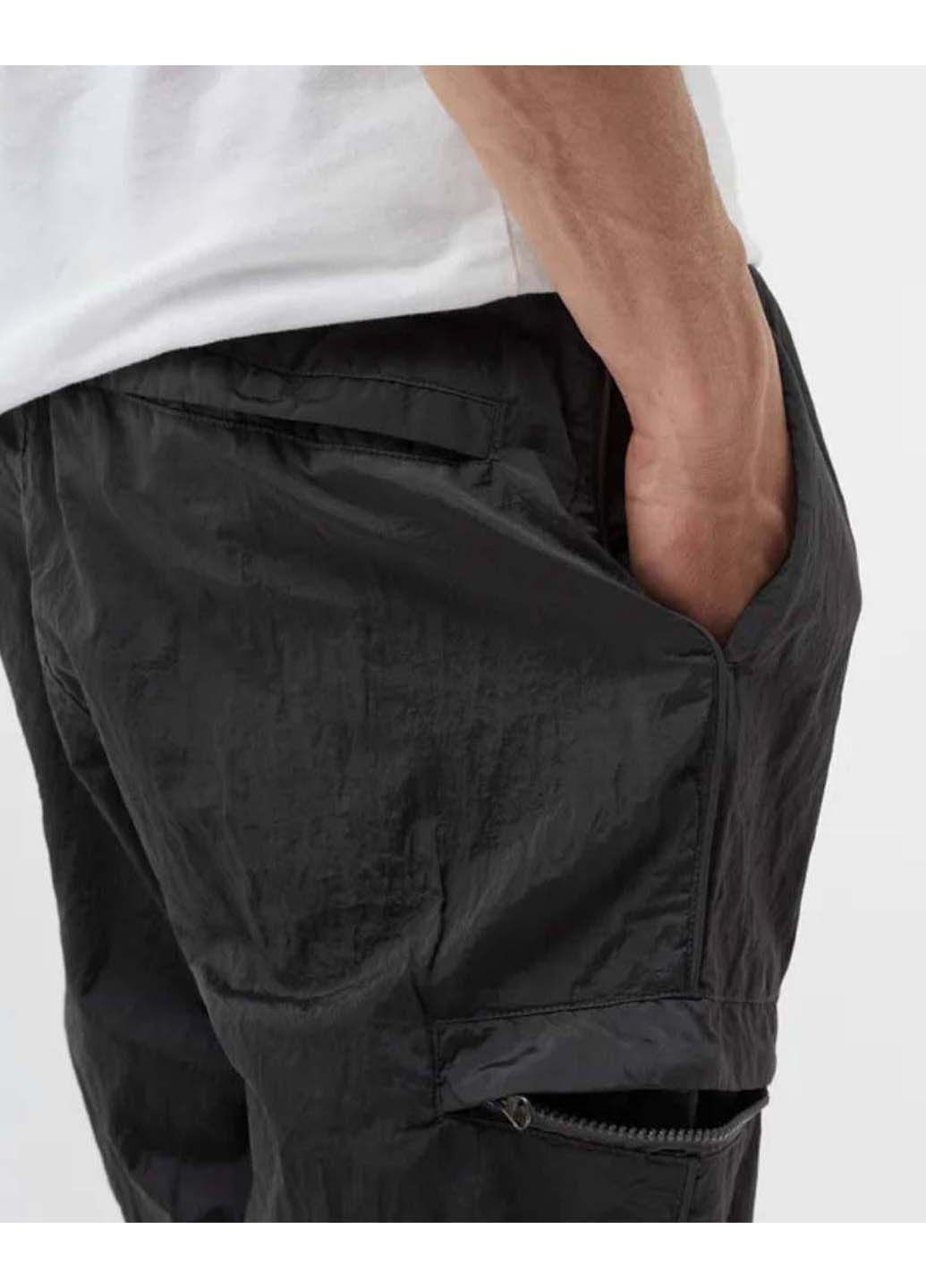 Черные демисезонные брюки Stone Island