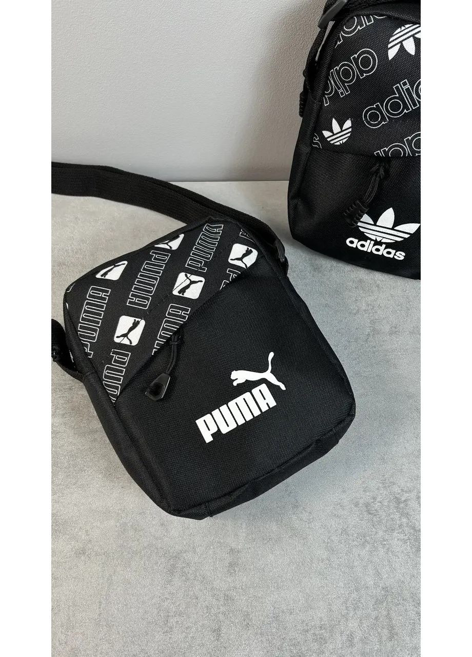 Барсетка в чорному кольорі - надійний аксесуар для міста No Brand (365762090)