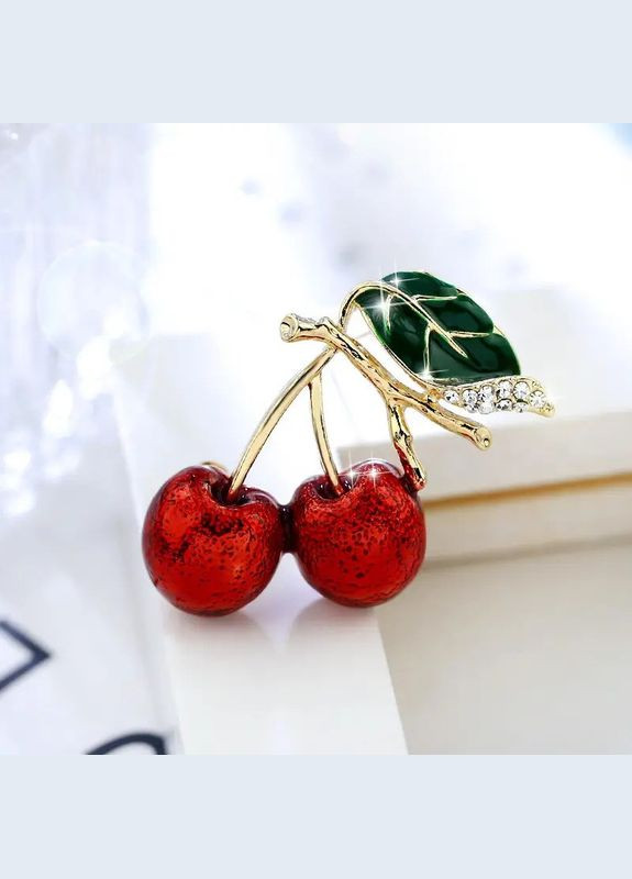 Золотиста брошка у вигляді червоної вишні з білими стразами 3 см LuxAurum285 Fashion Jewelry (346394948)