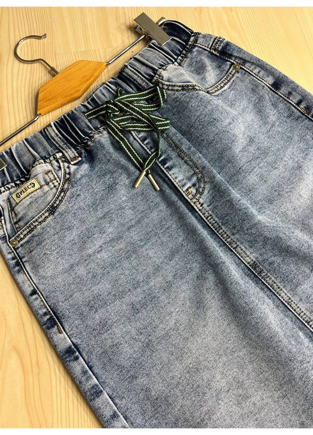 Спідниця жіноча джинсова ZJY 67501 талія на резинці зі шнурком нижче коліна розріз позаду блакитна No Brand (322948911)