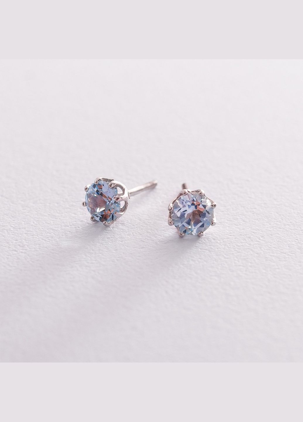 Золоті сережкипусети з блакитним топазом с06403 Oniks (264022451)