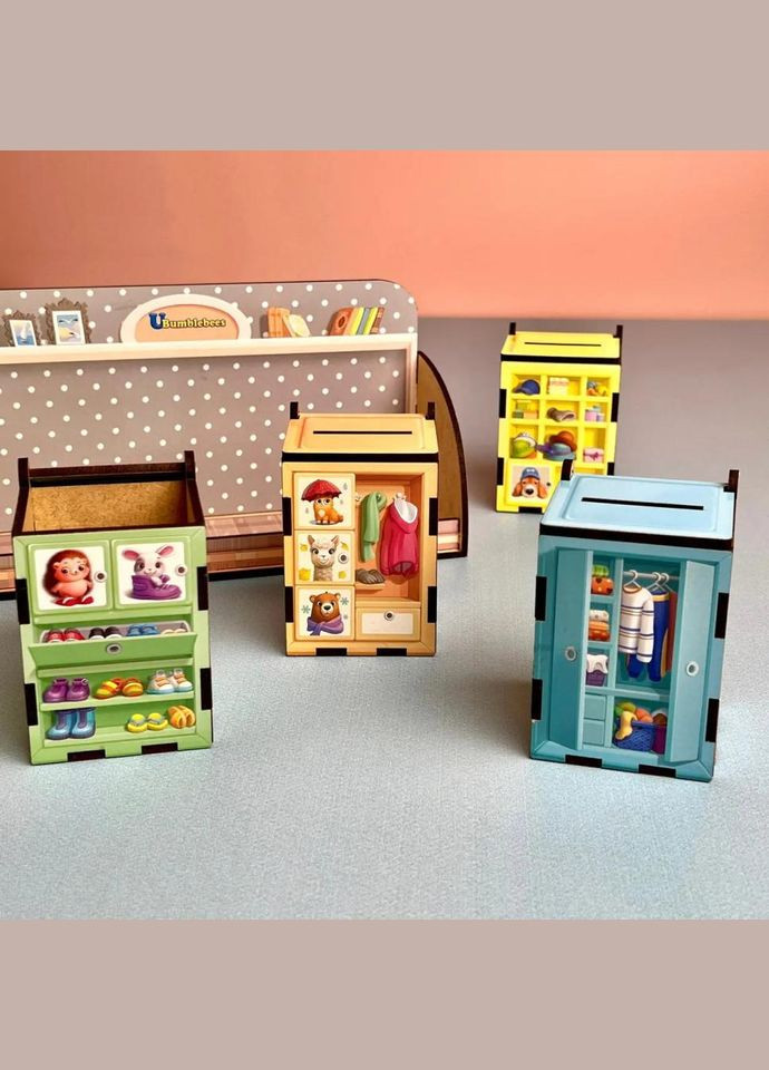 Дерев'яна настільна гра "Шафи з одягом" Ubumblebees (ПСД061) PSD061 сортер-комодик No Brand (330609519)