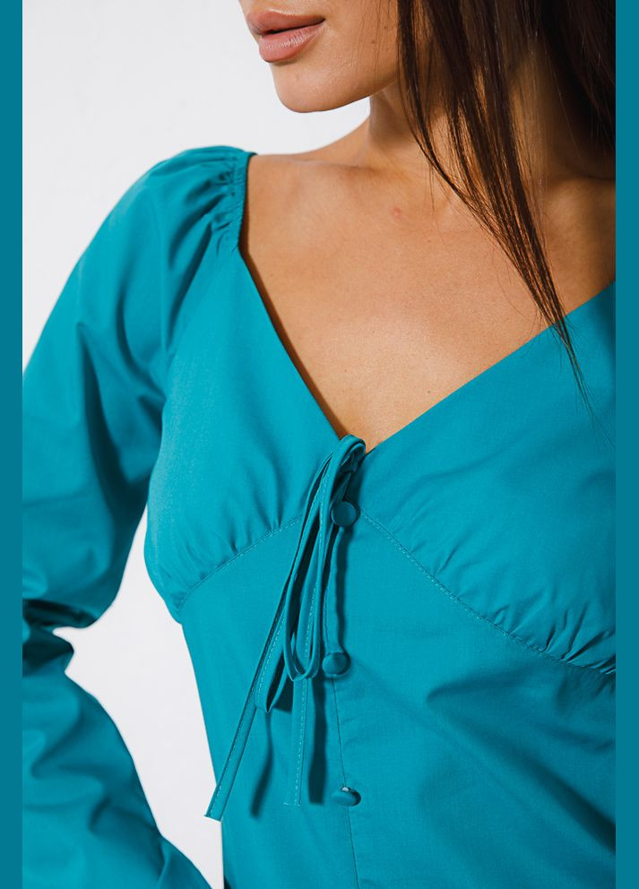 Бірюзова демісезонна укорочена блуза з бантиком на грудях Arjen