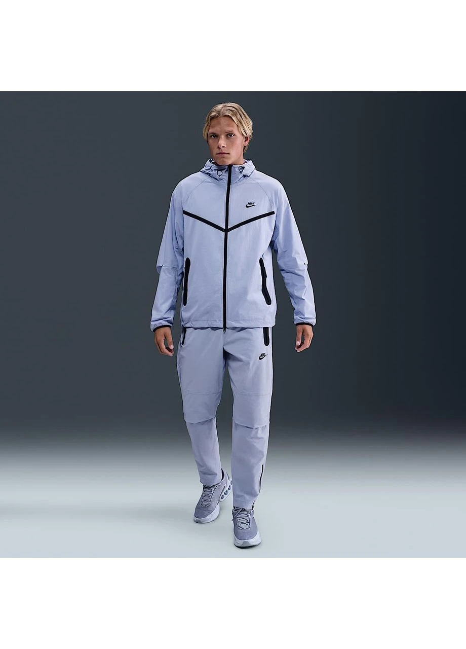 Синие демисезонные брюки Nike