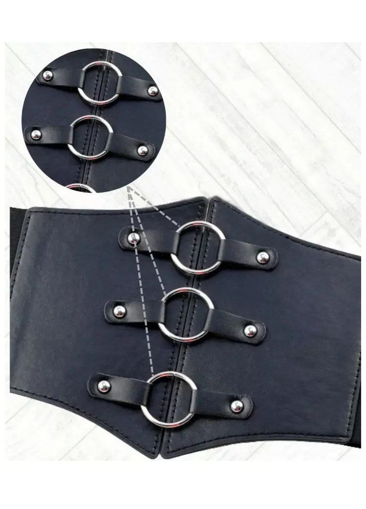 Утягивающий декоративный пояс корсет из экокожи с декоративными кольцами с заклепками эластичный No Brand Корсет декоративний з кільцями чорний (349507890)