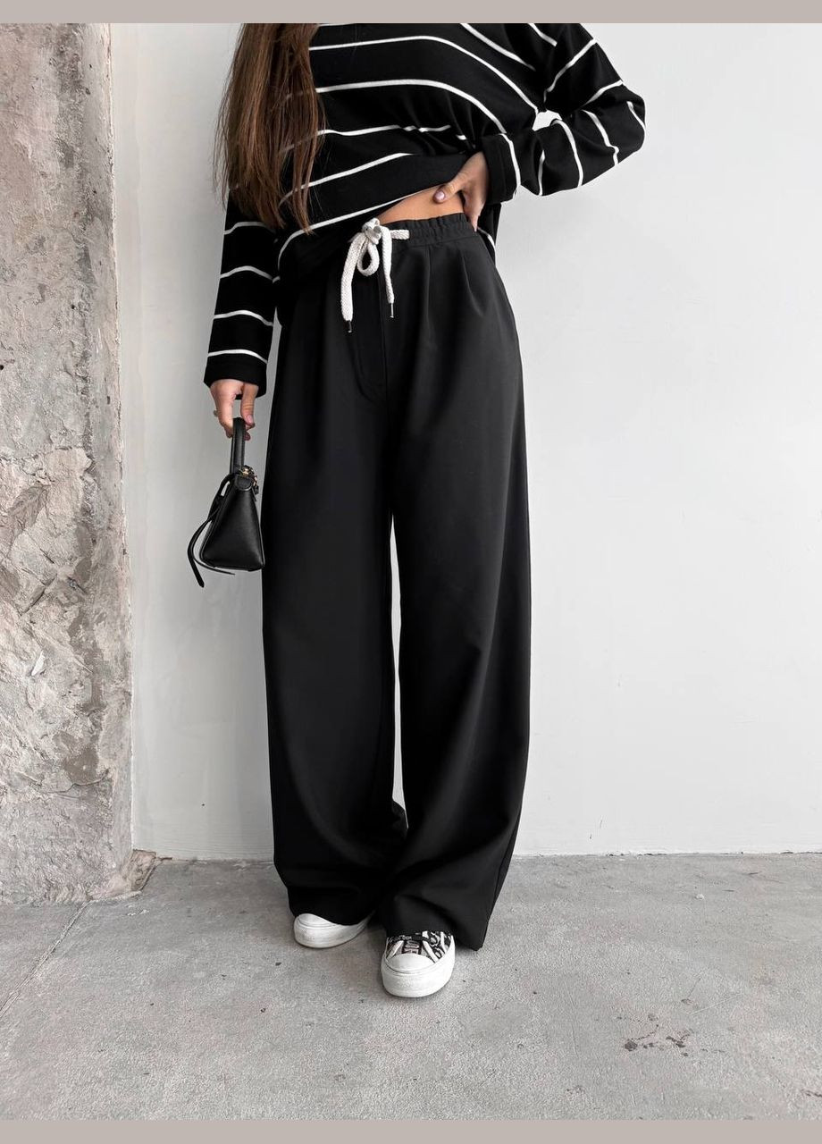 Жіночі брюки з декоративним шнурком колір чорний р.42 451517 New Trend (282926359)