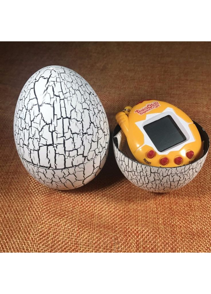Інтерактивна іграшка електронний вихованець Тамагочі в Яйці Динозавра Eggshell Game White (EggWhite) UFT (373640229)