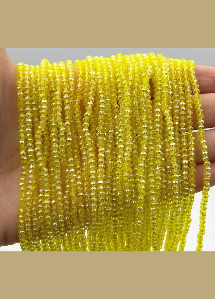 Намистини кришталеві Рондель, 3х2,4 мм, прозорі АВ, жовті, 175 шт No Brand (340486393)