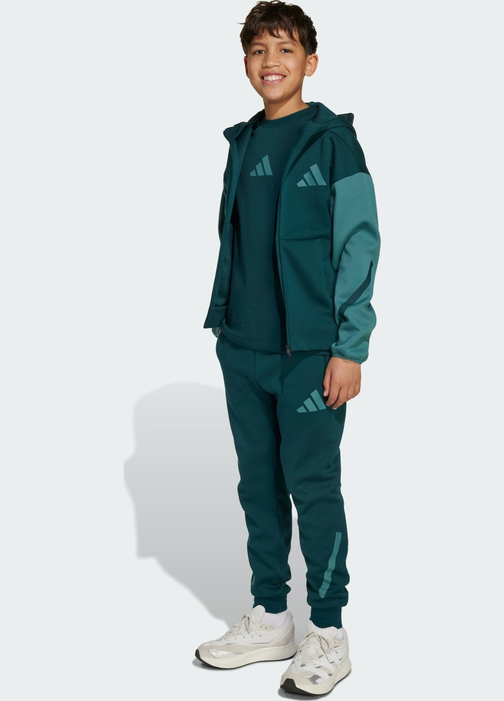 Зеленые спортивные демисезонные брюки adidas