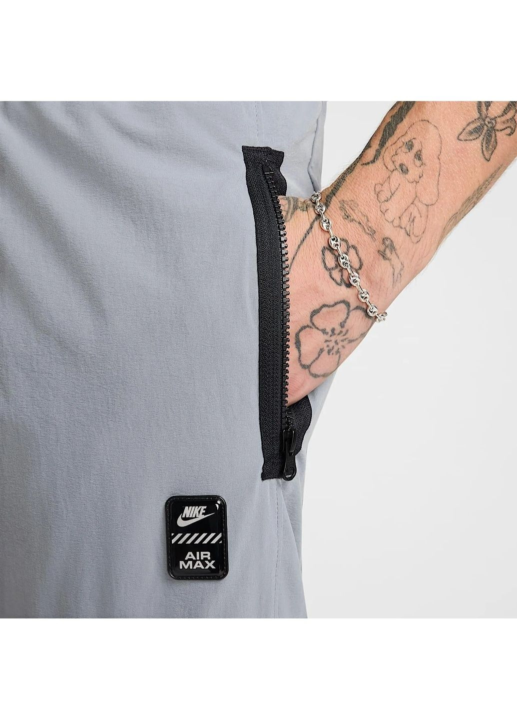 Серые демисезонные брюки Nike