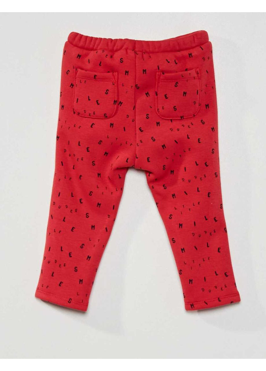 Красные брюки Kiabi