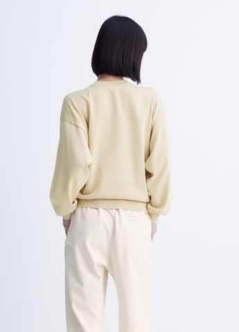 Бежевый свитшот Uniqlo однотонный без декора (296802939)