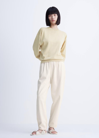 Бежевый свитшот Uniqlo однотонный без декора (296802939)