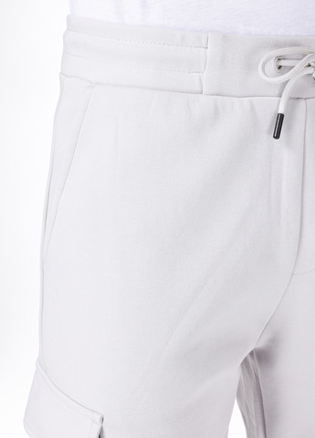 Белые спортивные демисезонные зауженные брюки Colin's