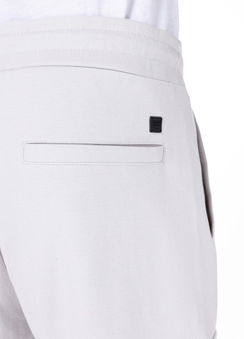 Белые спортивные демисезонные зауженные брюки Colin's