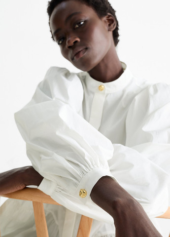 Біла блуза з баскою C&A