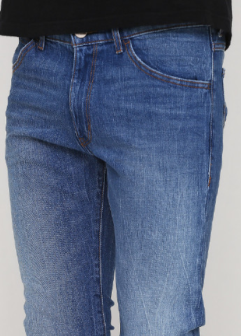 Синие демисезонные зауженные джинсы Wrangler