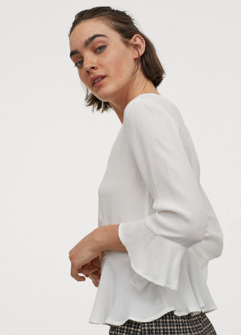 Молочна блуза з баскою H&M