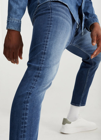 Синие демисезонные зауженные джинсы C&A