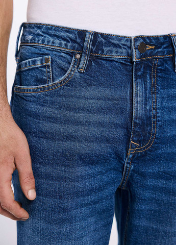 Синие демисезонные зауженные джинсы Springfield