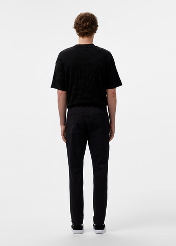 Черные кэжуал демисезонные зауженные брюки Lacoste