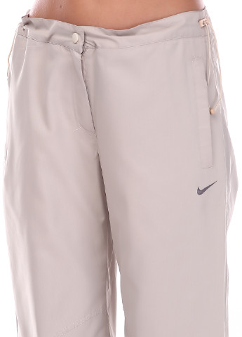 Штани Nike прямі однотонні світло-сірі спортивні