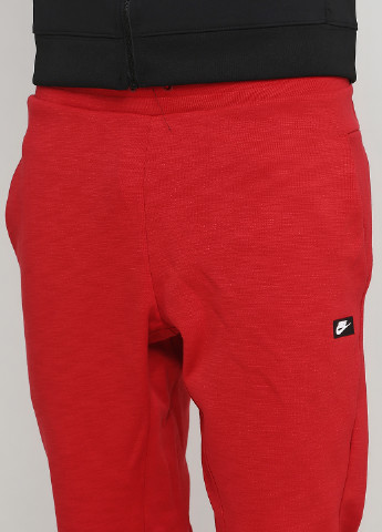 Красные спортивные демисезонные зауженные брюки Nike