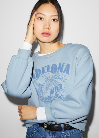 Голубой свитшот C&A рисунок без декора (316734880)