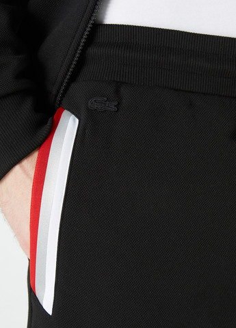 Черные спортивные демисезонные джоггеры брюки Lacoste