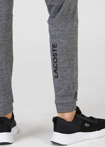 Серые спортивные демисезонные джоггеры брюки Lacoste