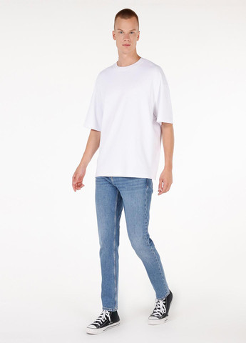 Синие демисезонные зауженные джинсы Colin's