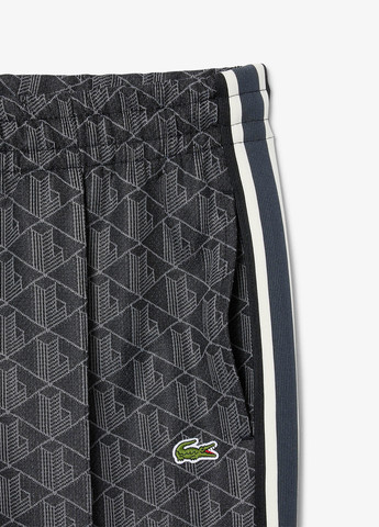 Темно-серые спортивные демисезонные зауженные брюки Lacoste