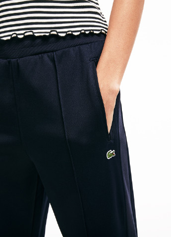Темно-синие спортивные демисезонные зауженные брюки Lacoste