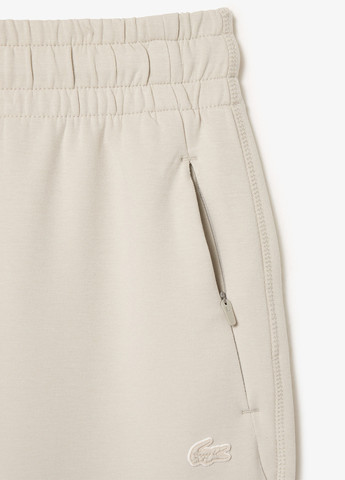 Светло-бежевые спортивные демисезонные джоггеры брюки Lacoste