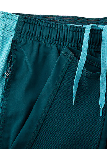 Зеленые спортивные демисезонные зауженные брюки Nike