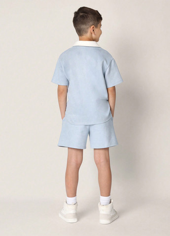 Светло-голубой летний костюм (поло, шорты) с шортами SHEIN