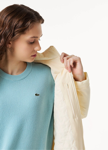 Бежевая зимняя куртка Lacoste