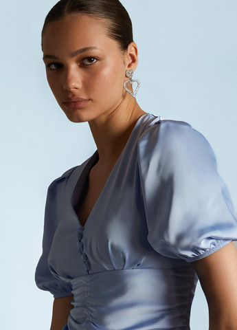 Світло-блакитна коктейльна сукня силуетна Gepur однотонна