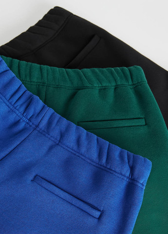 Темно-зеленые спортивные демисезонные зауженные брюки Reserved