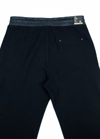 Штани жіночі шкірозамінник і трикотаж чорні Estensivo Slouchy (251839593)