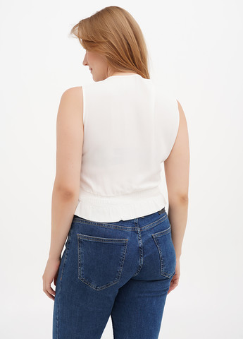 Молочна блуза з баскою Sassofono Club