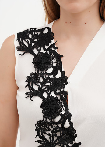 Молочна блуза з баскою Sassofono Club