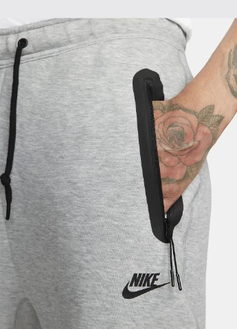 Серые спортивные демисезонные зауженные брюки Nike