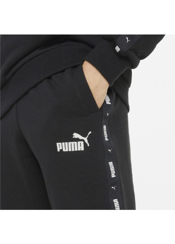 Дитячі штани Essentials+ Tape Youth Sweatpants Puma однотонні чорні спортивні бавовна, поліестер, еластан