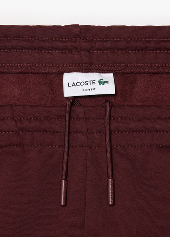 Бордовые спортивные демисезонные джоггеры брюки Lacoste