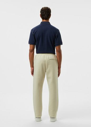 Бежевые спортивные демисезонные прямые брюки Lacoste