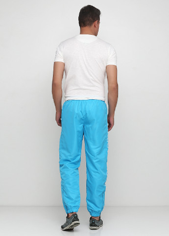 Голубые спортивные демисезонные зауженные брюки Sergio Tacchini