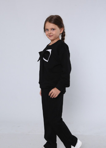 Чорний демісезонний дитячий трикотажний костюм зі змінними бантами на дівчинку брючний Zabavka костюм бант