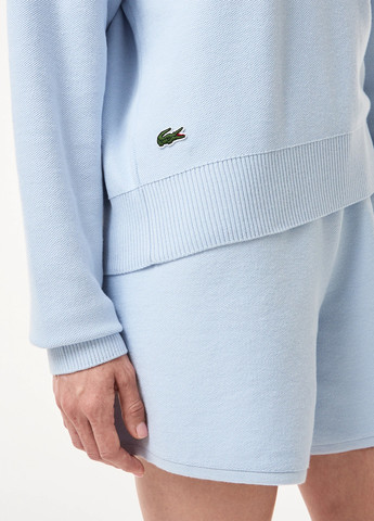 Голубой демисезонный свитер Lacoste